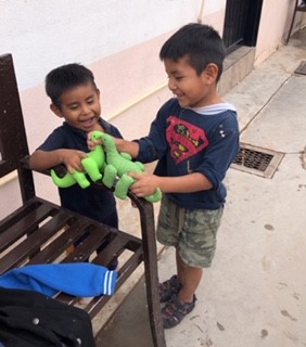 Boys play with the toys made by Sisters